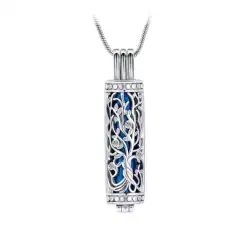 A silver cylindrical pendant with intricate vine and leaf patterns, featuring blue enamel accents inside, hangs from a silver chain—an elegant keepsake for pet cremation in Harris County, TX.