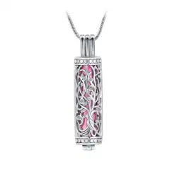 A silver cylindrical pendant with intricate filigree detailing—often chosen for pet cremation in Harris County, TX—reveals a pink element inside and hangs from a thin silver chain against a white background.