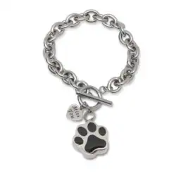 Silver chain bracelet with a large black paw print charm and a small heart-shaped tag reading "Wags & Wiggles," perfect for honoring beloved pets. Thoughtfully designed for those seeking pet cremation in Harris County, TX. Features a toggle clasp.