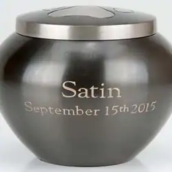 A metallic urn with a lid, engraved with the word "Satin" and the date "September 15th 2015" on the front, ideal for pet cremation in Harris County, TX.