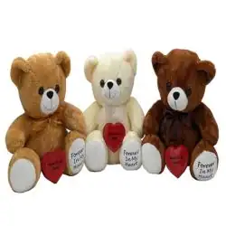 Three plush teddy bears—one light brown, one white, and one dark brown—sit side by side, each holding a red heart with "Forever in My Heart," a touching tribute for pet cremation in Harris County, TX.